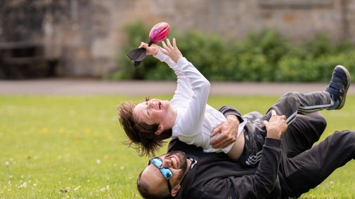 Father and son enjoying games in the courtyard at Wallington